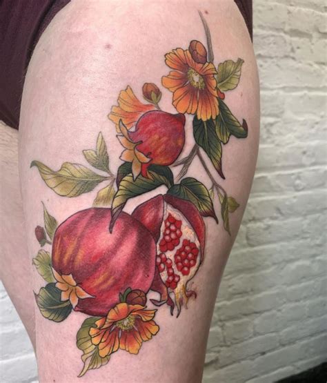 Little Tattoos — Pomegranate tattoo on the right inner arm