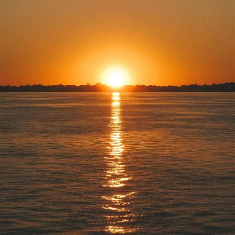 Por do sol no píer da praia da ponta negra em Manaus am . | Manaus