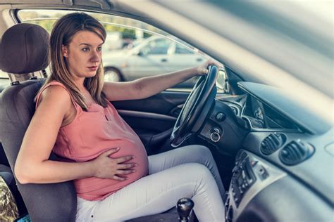 pregnant woman car accident checking the baby