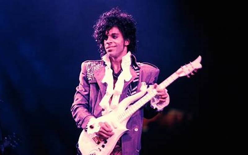 Prince Playing Guitar In Computer Blue