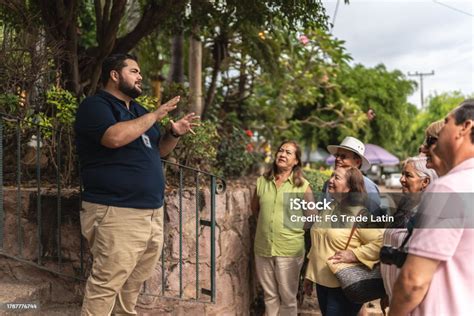 A private tour guide explaining the history of a site