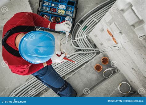Professional Electrician Checking Wiring