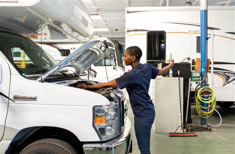 Professional RV technician working on a engine