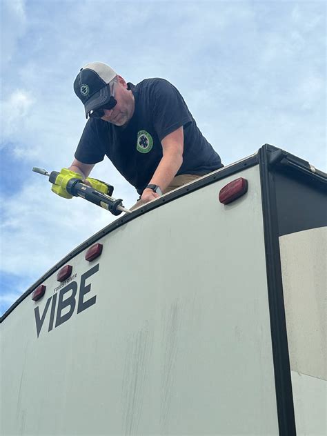 RV Repair Kansas City Technician Checking Engine