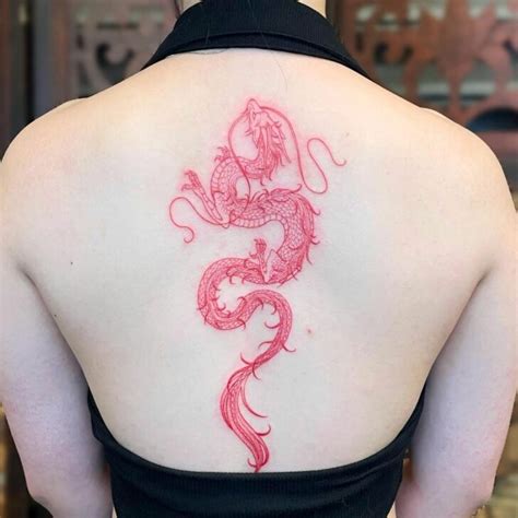 Scarlet Strokes of Artistry: Unleashing the Allure of Red Ink in a Bold Back Tattoo Design