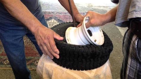 Reinstall the tire onto the lawn mower