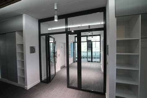 Frameless glass fire doors Glasstec Systems