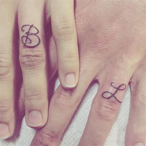 Ring Finger Initial Tattoos