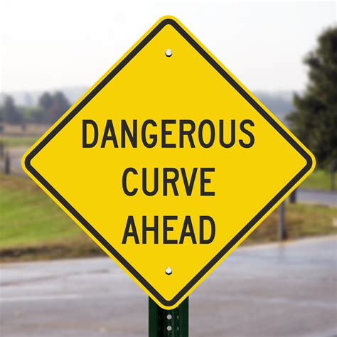 Road signs indicating a dangerous curve ahead