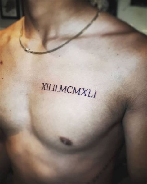 Roman Numerals On Chest Tattoo