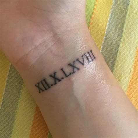 Roman Numerals Tattoo Wrist