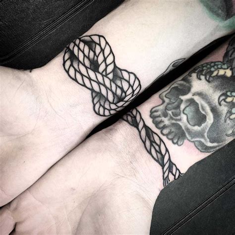 Knotted rope bracelet tattoo inked around the right wrist