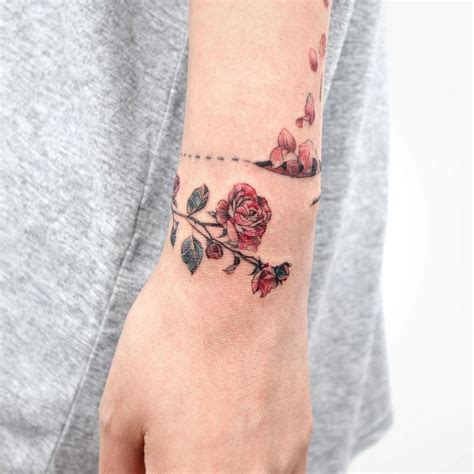 Rose cuff tattoo Cuff tattoo, Tattoos, Henna hand tattoo