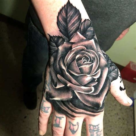 Rose In Hand Tattoo