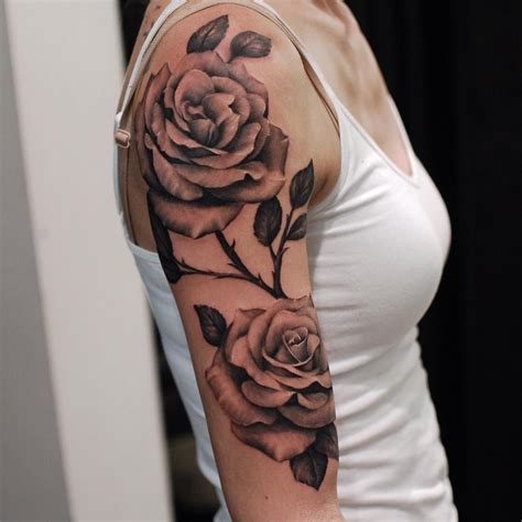 Red rose tattoo on the upper arm. Red rose tattoo