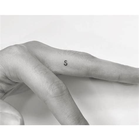 S Letter Tattoo On Finger