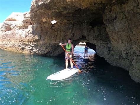 SUP paddleboarding along cliffs