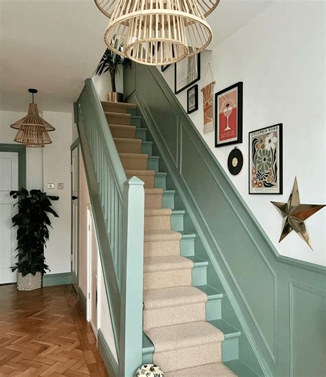 sage green staircase takes center stage in montreal residence