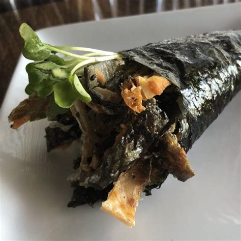 Savor the Crispy Goodness and Bounty of Nature with Our Delectable Salmon Skin Hand Roll