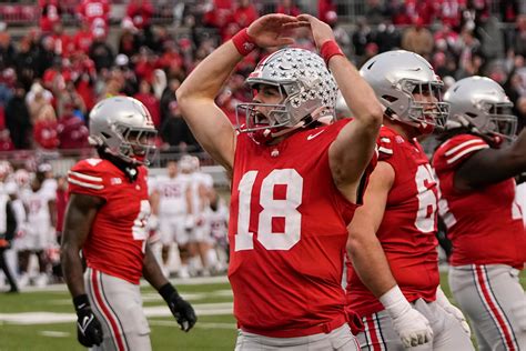 The Buckeyes Bring Home the Glory with a Stunning Score in the Latest Game: A Victory to Remember!