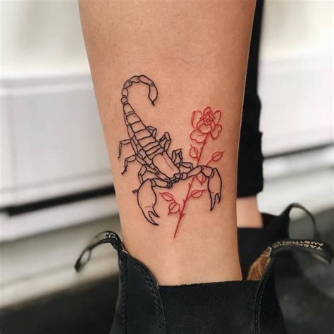 Scorpion and red rose tattoo