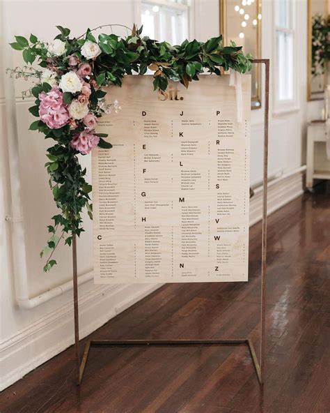 Trilogy at Vistancia Wedding A wooden guest seating chart with