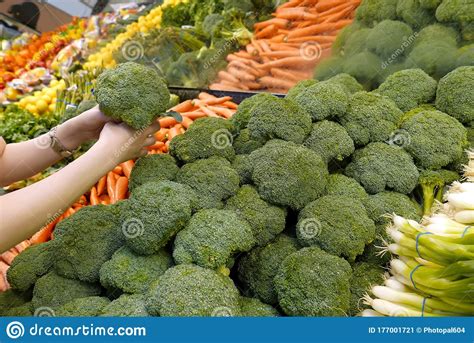 Selecting Broccoli Image