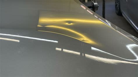 Signs of Car Dent Damage Denver