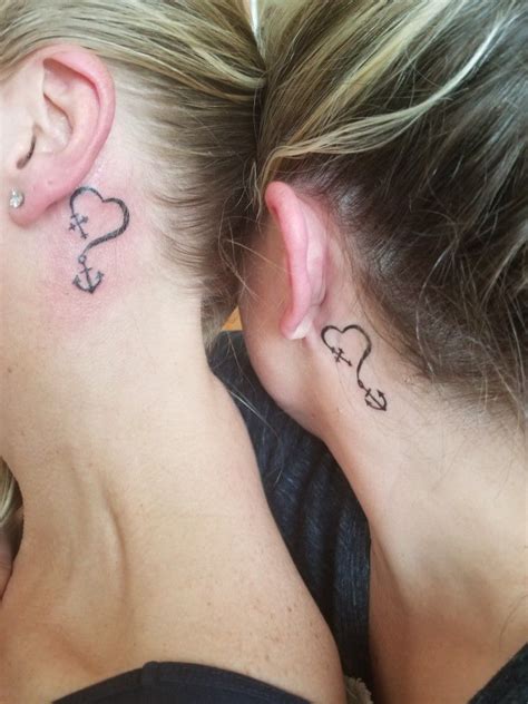 Silhouettes of Loved Ones Tattoo Behind the Ear