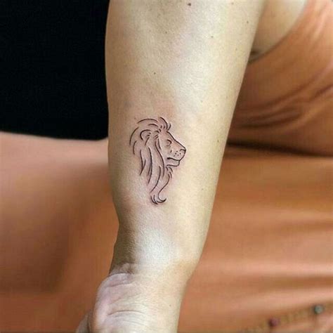 Simple illustrative style thigh tattoo of roaring lion