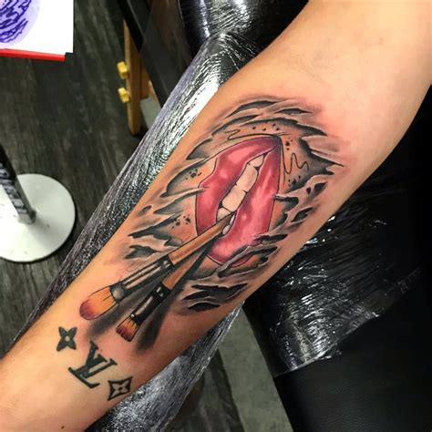 A Roundup of Great Ripped Tattoo Designs 2015