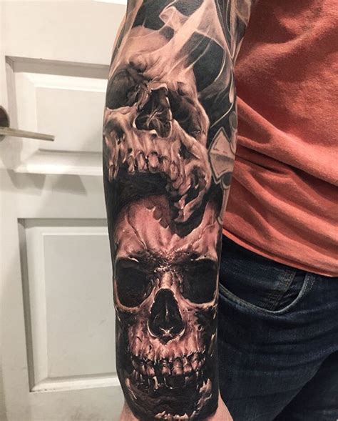 Skulls half sleeve by done at