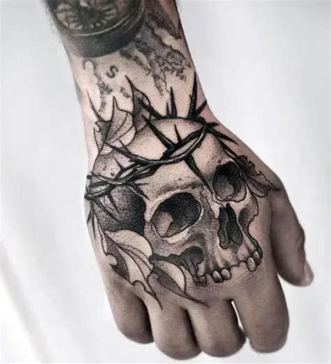 Skull And Hand Tattoo