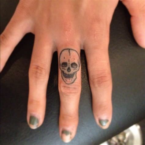 His n hers skull finger tattoos Skull finger tattoos