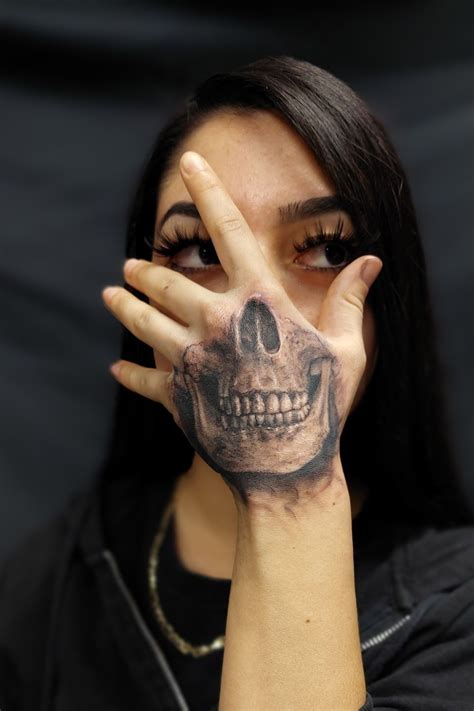 Skull Hand Tattoos