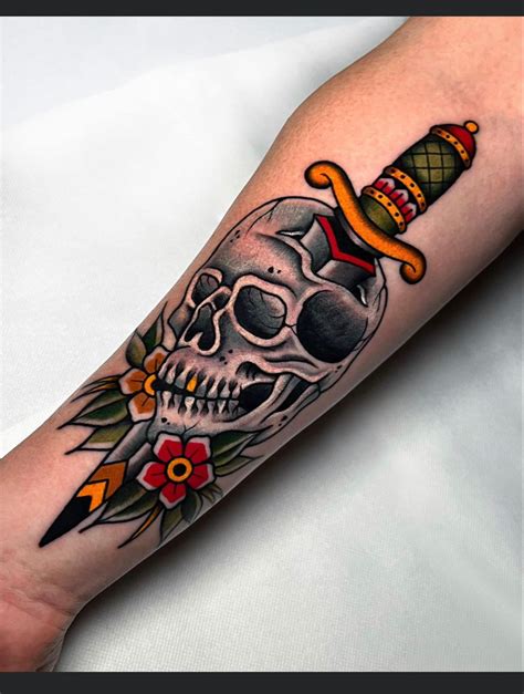 Skull With Dagger Tattoo