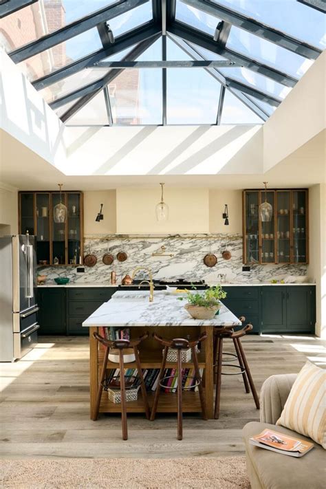Bring Natural Light to Your Culinary Haven with a Chic Skylight Above Your Kitchen Island!