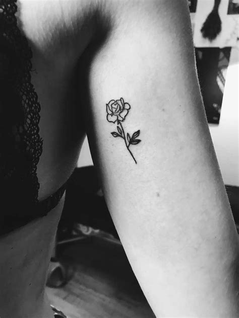 Simple small black rose tattoo