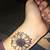 Small Sunflower Tattoo On Wrist