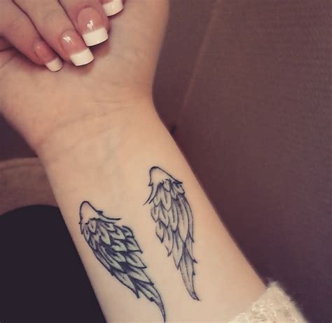 Women Tattoo small angel wings tattoo. I love this