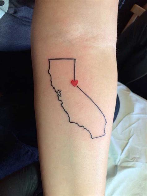 Tiny outline California map tattoo inked on the left wrist