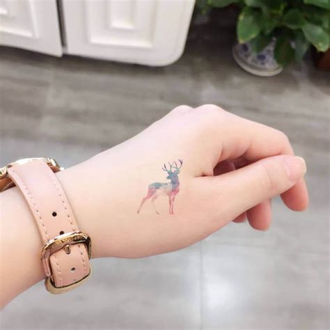 Deer tattoo small black and grey Wrist tattoos for guys