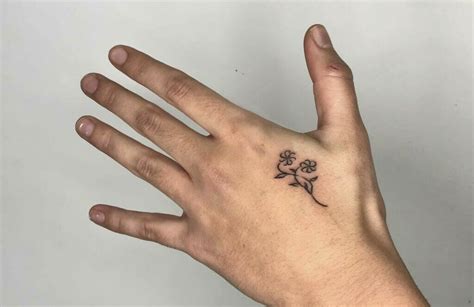 10 Minimalist Must-Have Small Hand Tattoos for Men - Elevate Your Style with These Trendy Designs!