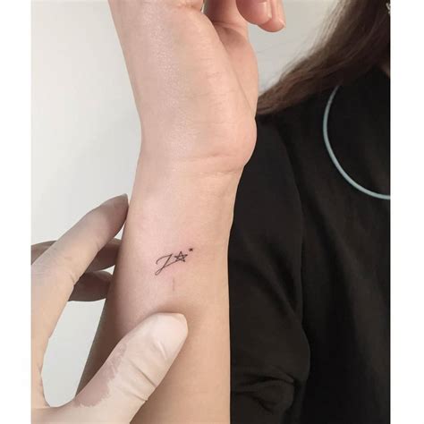 Small Initial Tattoo On Wrist