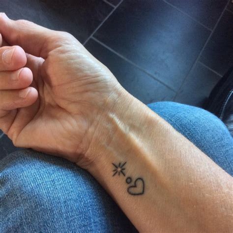 "Resilience" tattoo on the left inner wrist.