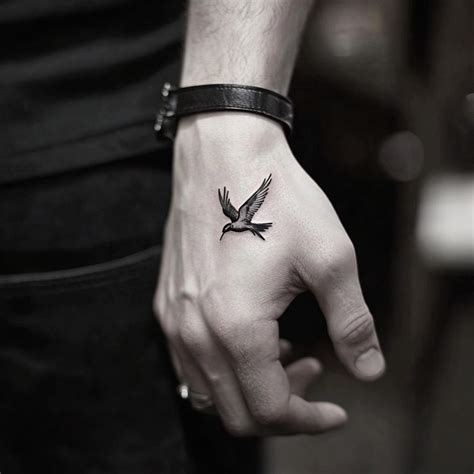 Miniature Masterpieces: 10 Small Tattoos to Elevate Men's Hands