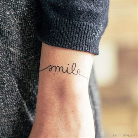 24 Wonderful Smile Wrist Tattoos