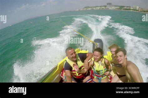 Smiling People on Speedboat