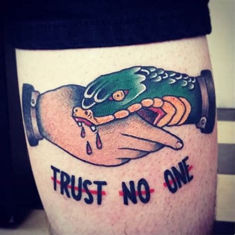 TRUST NO ONE Snake bites hand tattoo in 2020 Hand