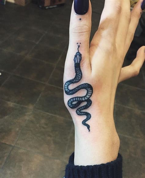 Snake On Hand Tattoo